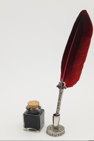 feather pen and inkwell